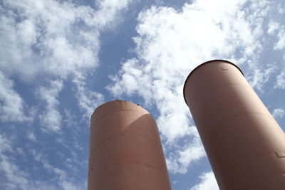 Low angle view of smoke stack against sky