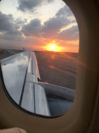 High angle view of landscape seen through airplane window