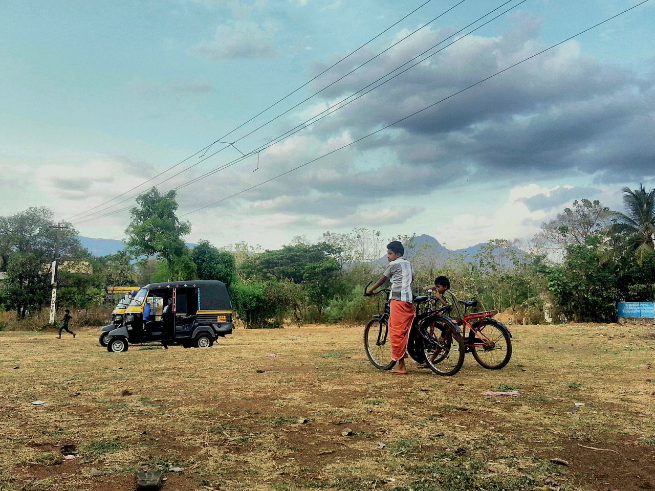 land vehicle, transportation, bicycle, mode of transport, riding, stationary, sky, motorcycle, men, lifestyles, travel, parked, cycling, parking, leisure activity, on the move, full length, cloud - sky