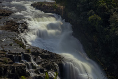 Scenic view of waterfall in forest