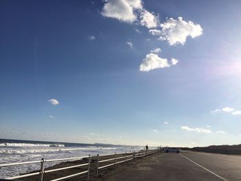 Scenic view of road against cloudy sky