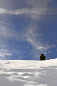 Scenic view of snow field against sky