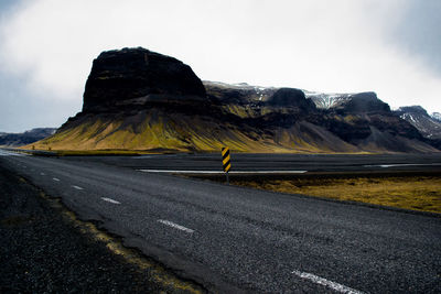 Scenic view of mountain road against sky