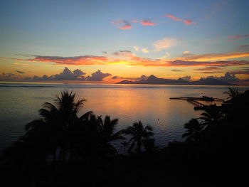 Scenic view of lake at sunset