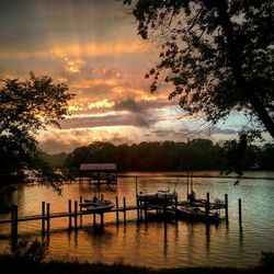 Scenic view of calm lake at sunset