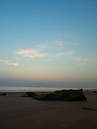 View of beach against sky during sunset