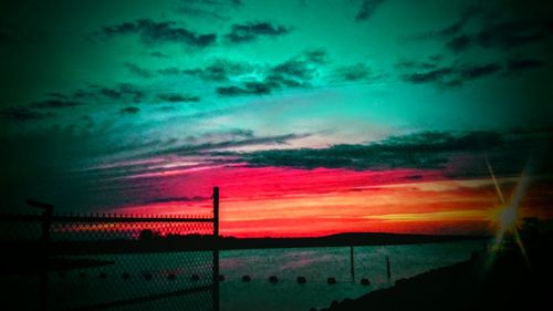 Scenic view of landscape against sky at sunset