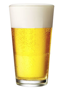 Close-up of beer glass against white background