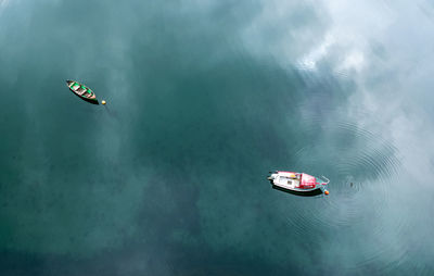 High angle view of boat sailing in sea