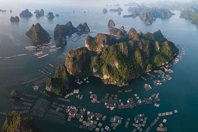 High angle view of mountains by sea