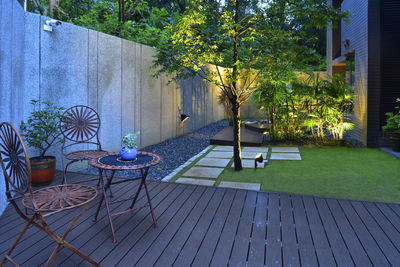 Chairs and table in yard of house