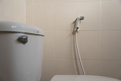 Close-up of flush tank over toilet seat