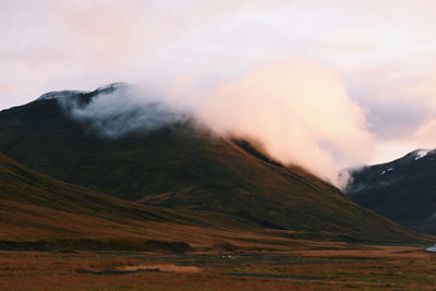 Scenic view of volcanic mountain against sky