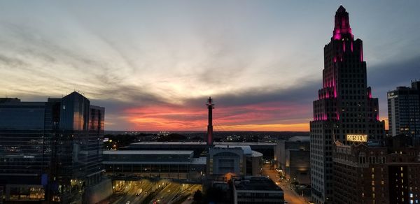 High angle view of buildings in city during sunset