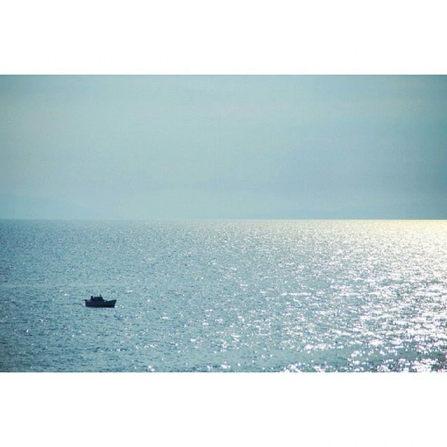 water, sea, horizon over water, transfer print, nautical vessel, tranquil scene, tranquility, auto post production filter, scenics, clear sky, boat, waterfront, copy space, transportation, beauty in nature, nature, rippled, mode of transport, seascape, sailing