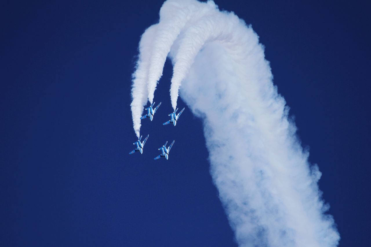 blue, low angle view, cold temperature, smoke - physical structure, motion, white color, copy space, winter, clear sky, snow, nature, sky, outdoors, beauty in nature, frozen, day, underwater, undersea, spraying, speed