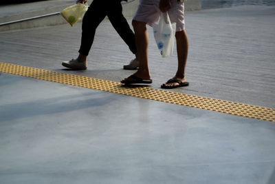 Low section of men standing outdoors