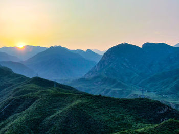 Scenic view of mountains against sky during sunset