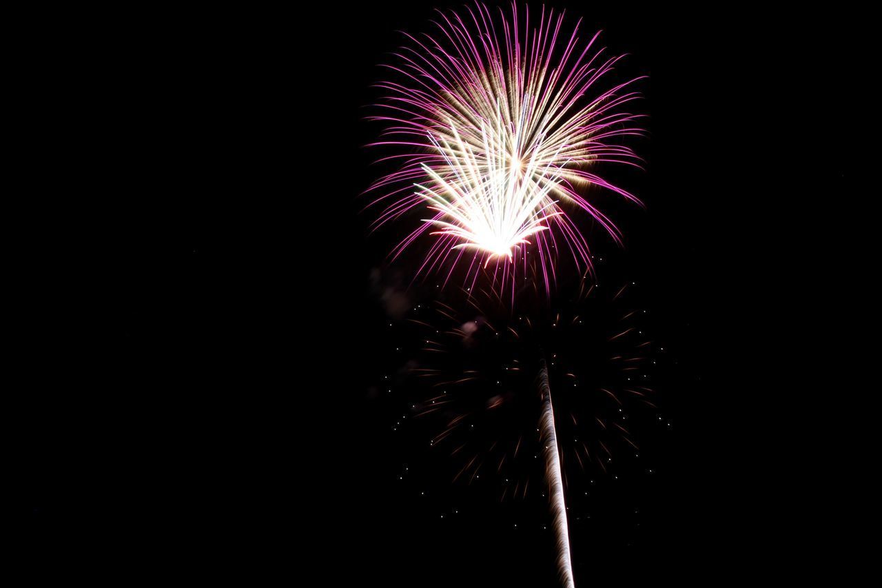 LOW ANGLE VIEW OF FIREWORK DISPLAY