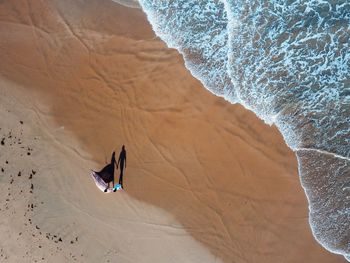 High angle view of a couple on a beach