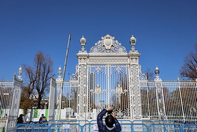 Low angle view of statue against blue sky