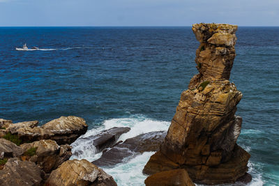 Scenic view of cabo carvoeirp rocks in sea against sky