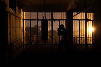 Side view of a silhouette boxer