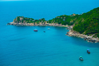 High angle view of sailboats in sea