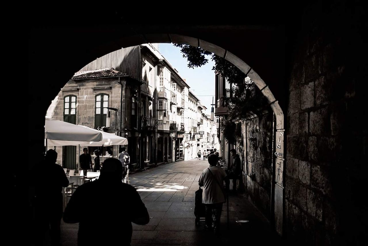 architecture, rear view, built structure, real people, women, walking, building exterior, the way forward, lifestyles, one person, men, day, adult, people