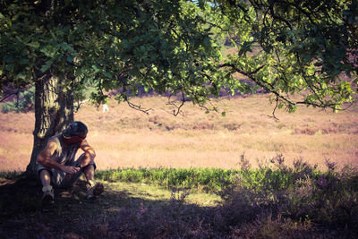 Man sitting on field