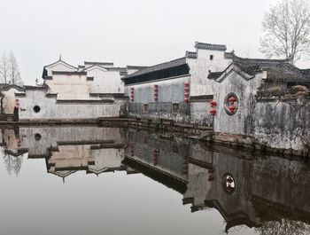 Old building reflecting in pond