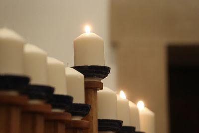 Close-up of illuminated candles at home