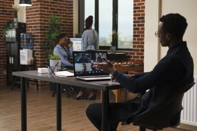 Man using laptop at table