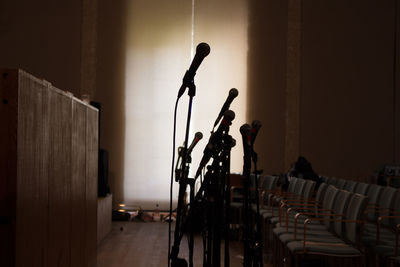 Close-up of microphones in seminar hall