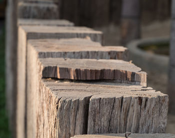 Close up view of old vintage chock wood, fence design countryside style.