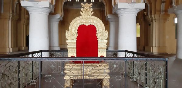 Red metallic railing against building