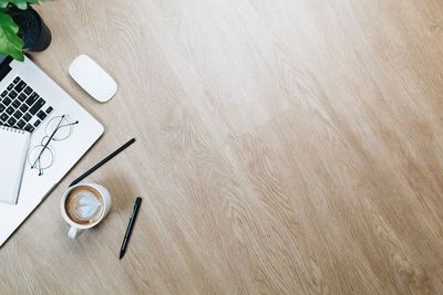 High angle view of coffee cup on table