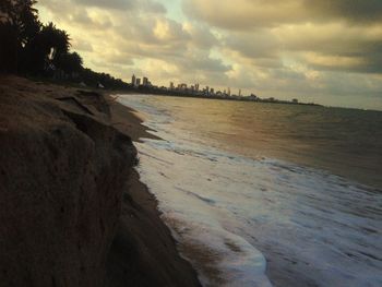 Scenic view of sea against cloudy sky