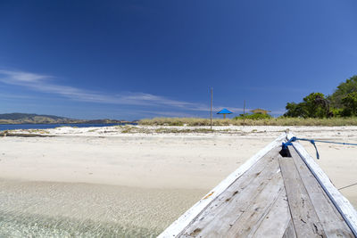 Scenic view of beach against blue sky