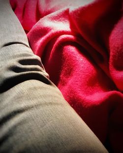 Low section of man wearing red fabric
