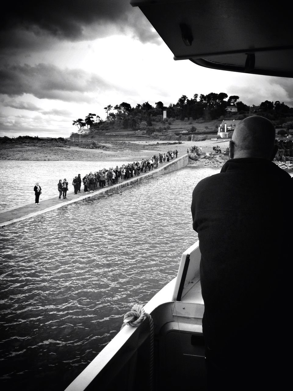 water, mode of transport, sky, lifestyles, leisure activity, boat, river, cloud - sky, cloud, tourist, day, nature, part of, mountain, outdoors, cropped, journey, unrecognizable person, tourism, vacations, travel destinations, scenics, coastline