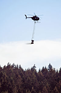 Low angle view of ski lift against sky