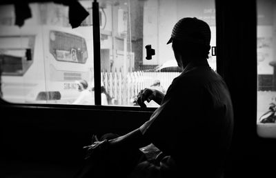 Man looking out the bus window