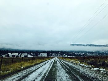 Road against sky during winter
