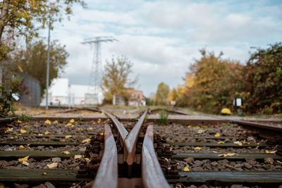 Close-up of railroad track against sky