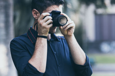 Portrait of man photographing