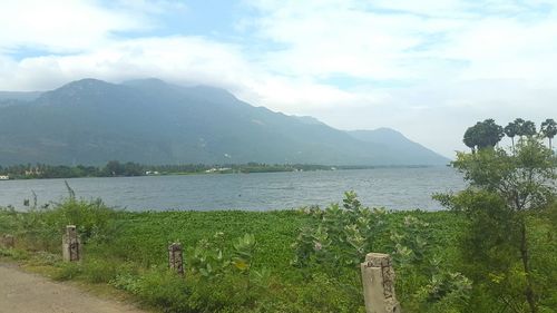 Scenic view of mountains against cloudy sky