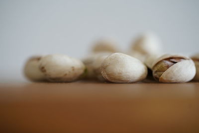 Close-up of eggs on table against white background