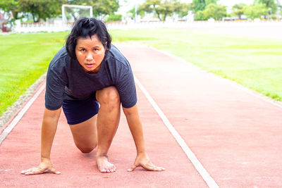 Portrait of sweaty athlete on running track