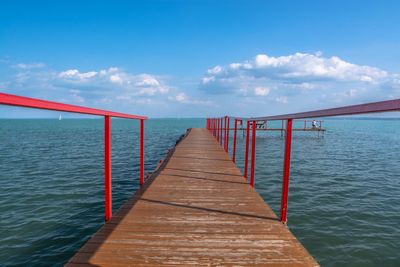 Pier over sea against sky